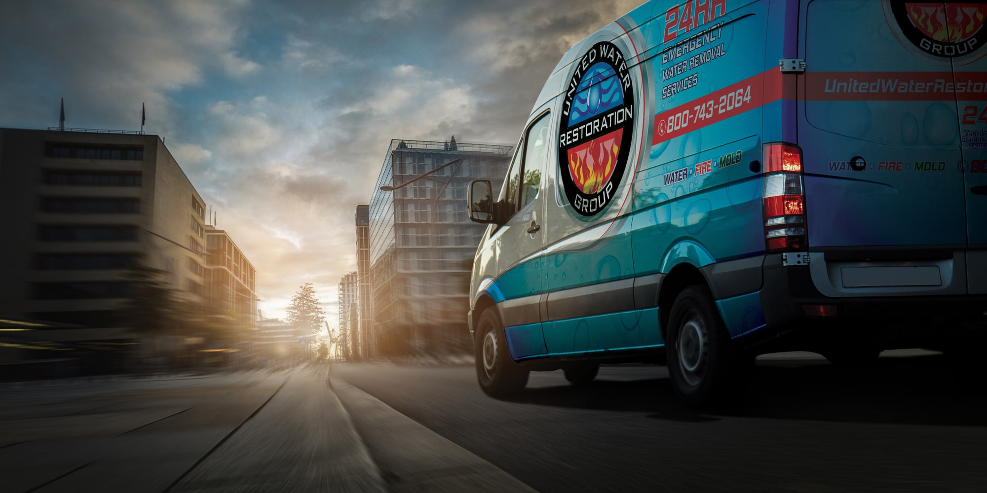 A United Water Restoration Group of McKinney van heading out on an emergency call at sunset